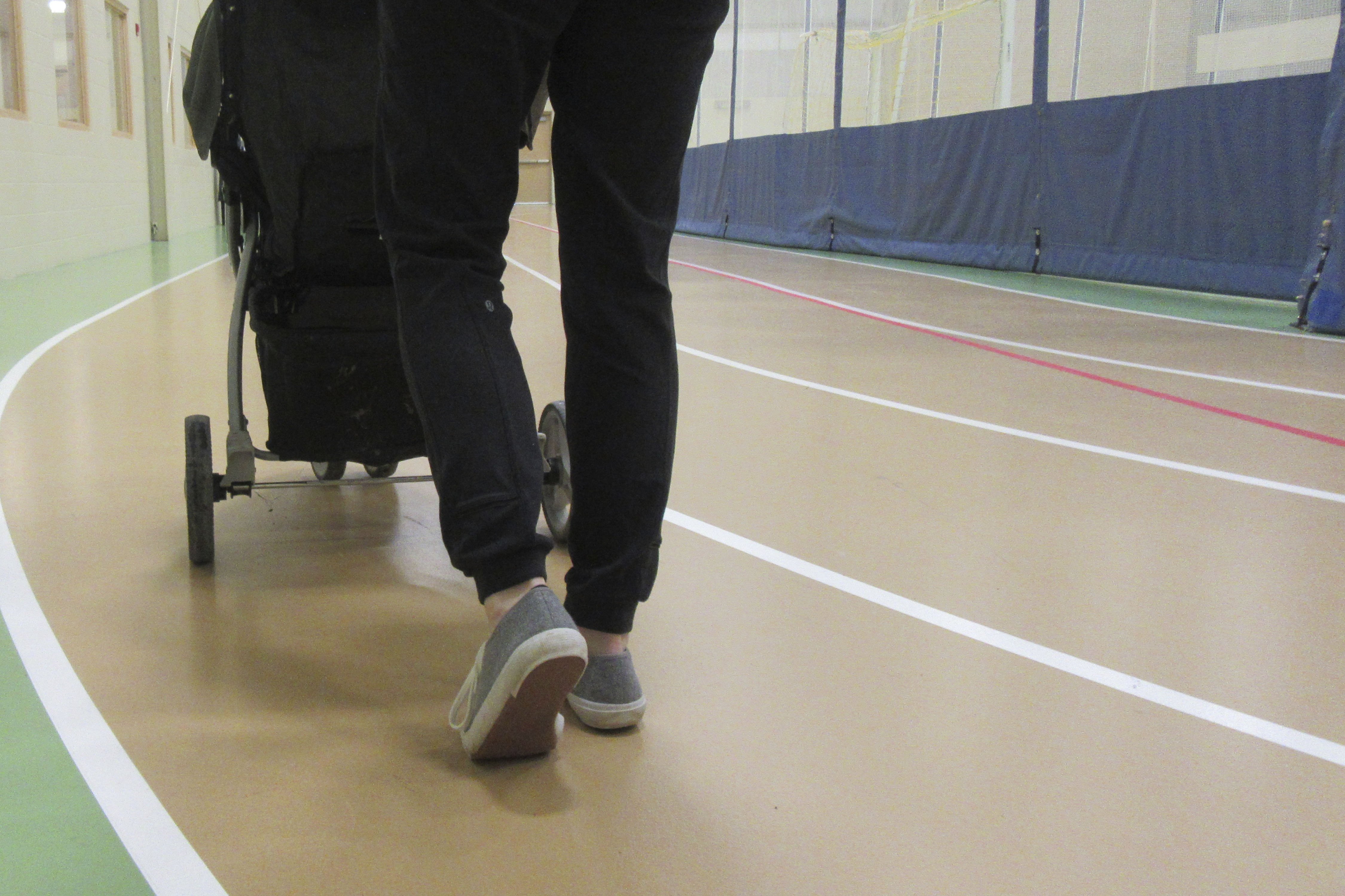 Person walking on indoor track